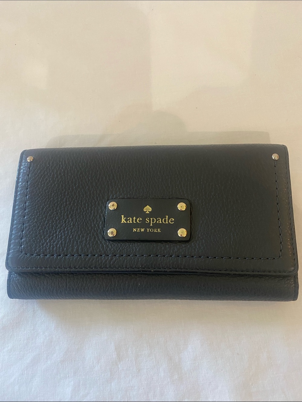 kate spade black leather wallet with gold plaque